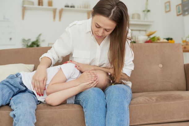 Mother Holding Crying Child